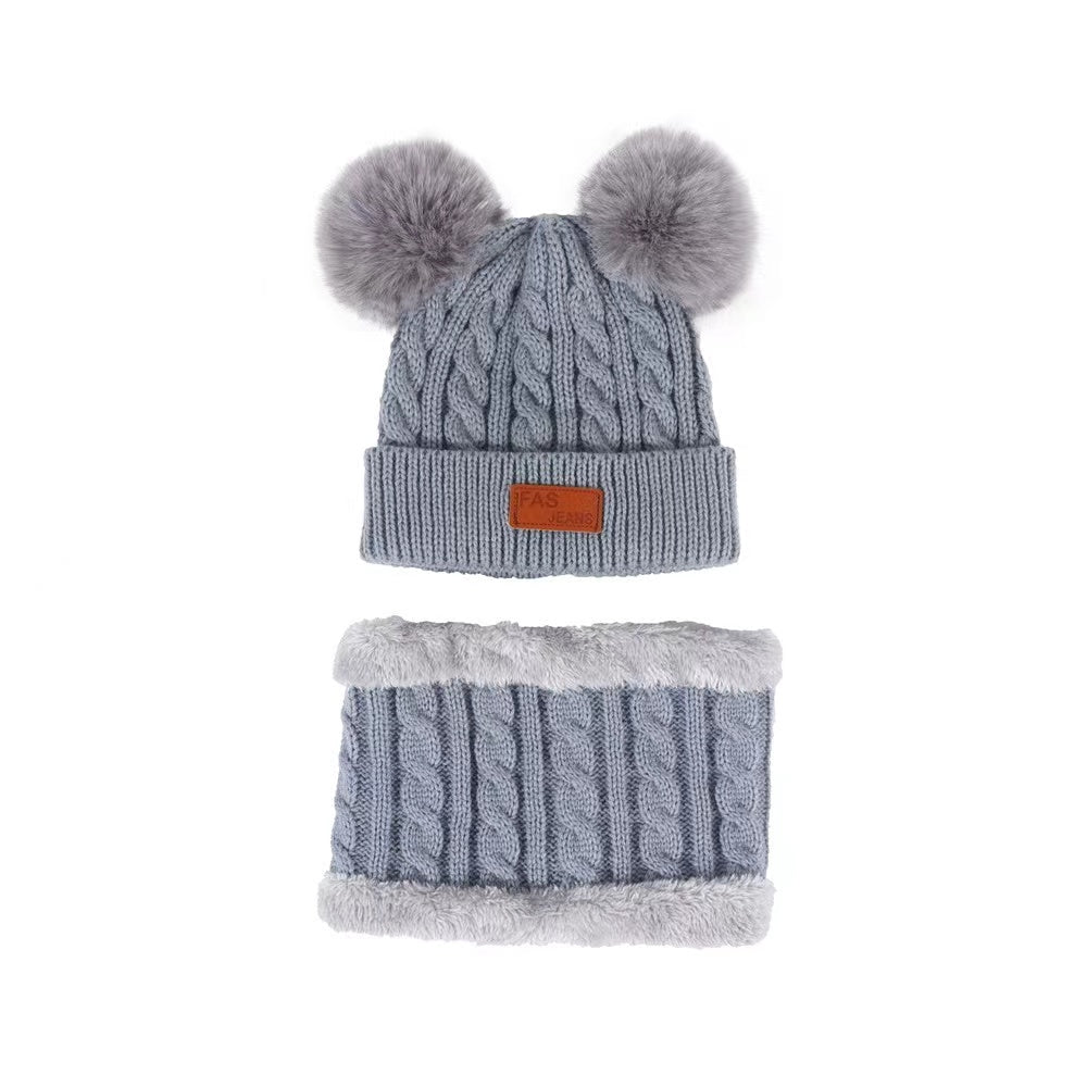 Bonnet à pompon et tour de cou pour bébé