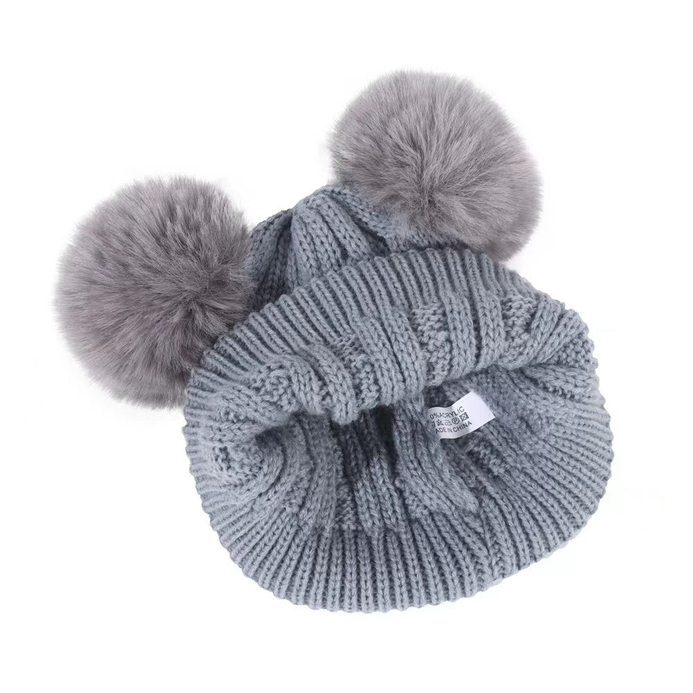 Bonnet à pompon et tour de cou pour bébé