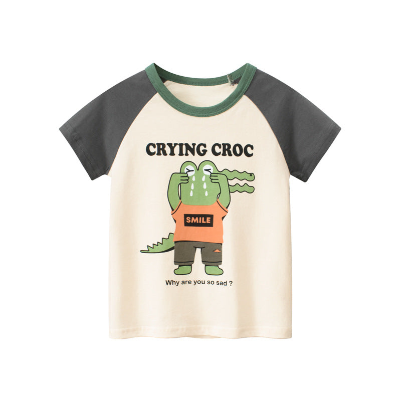 T-shirt pour enfant avec des manches courtes arborant un motif de crocodile.